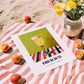 French 75 – on Striped Tablecloth, French Cocktail Still Life, unframed on coastal sand