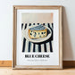 Blue – on Striped Tablecloth, Cheese Poster, in wooden frame leaning on the floor