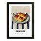 Brioche – on Striped Tablecloth, French Pastry Painting, in sleek black frame