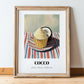 Cocco – on Striped Tablecloth, Gelato Painting, in wooden frame leaning on the floor